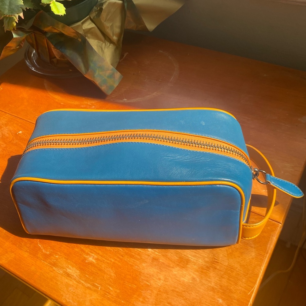 Blue leather Coach travel toiletry bag